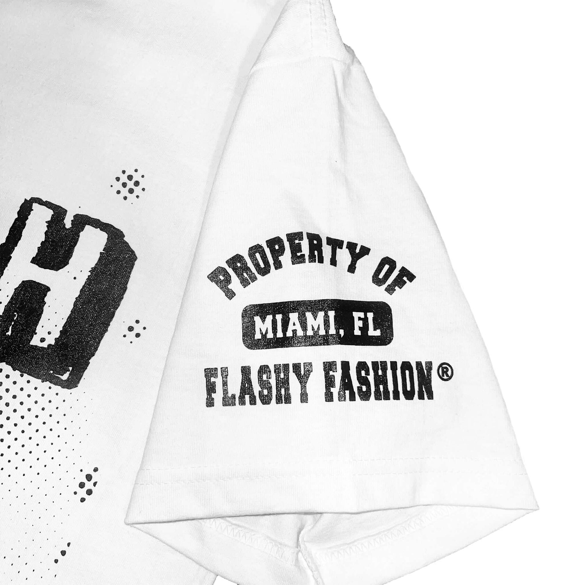 T-Shirt features a black design with "Stay Fresh, Stay Fly, Wear Flashy" on the front and the Property of Flashy Fashion design on left sleeve. T-shirts are 7.5 oz. 100% USA cotton with an oversized/relaxed fit with slight drop shoulder.